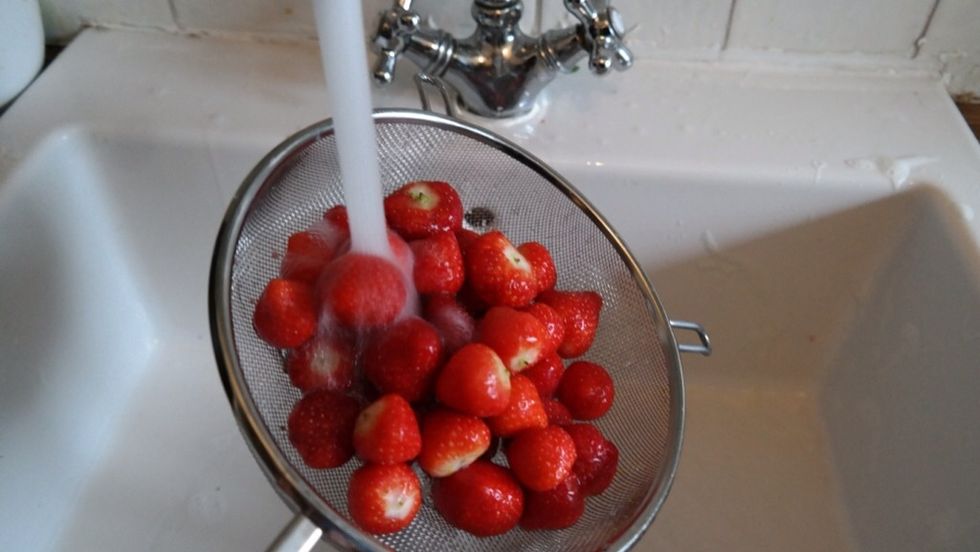 Wash strawberries and lemons under "warm" water. Strawberries are one of the dirtiest fruits. You must wash lemons too as we need the zest from 2 lemons.