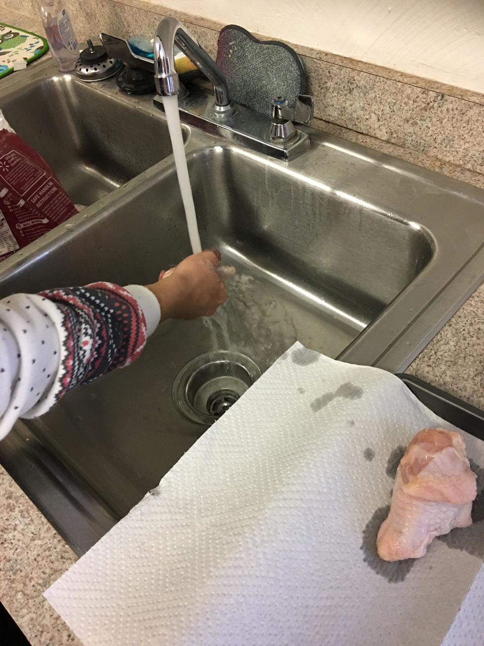 Wash the chicken with warm water.