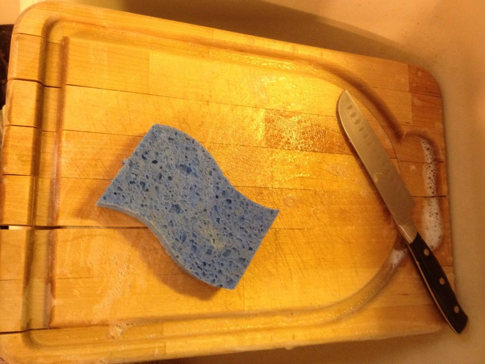 Wash the cutting board and knife. Raw and cooked don't mix!