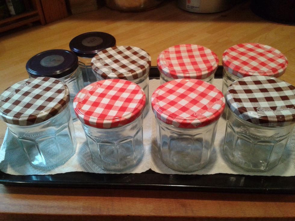 Wash the empty jars in hot soapy water or the dishwasher. Turn the oven on low and place the jars upside down on a baking sheet, use a piece of kitchen paper under the jars to mop up any moisture.