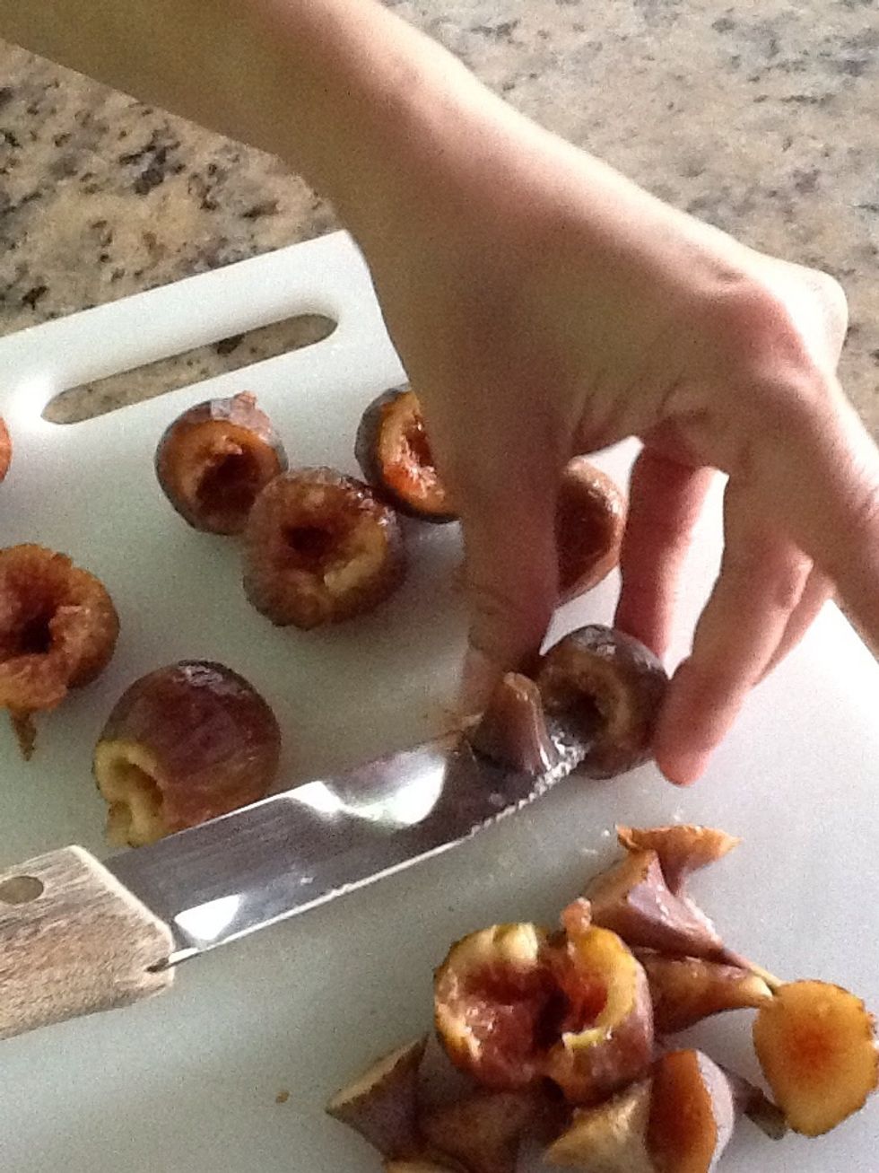 Wash the figs, cut the stems off, and make a tiny hole in them. This is where you will stuff the goat cheese.