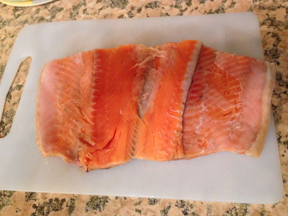 Wash the fish and divide it in half