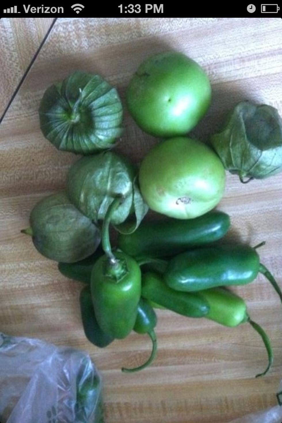 Wash the jalape\u00f1os & tomatillo - take the leaf off of the green tomatoes.