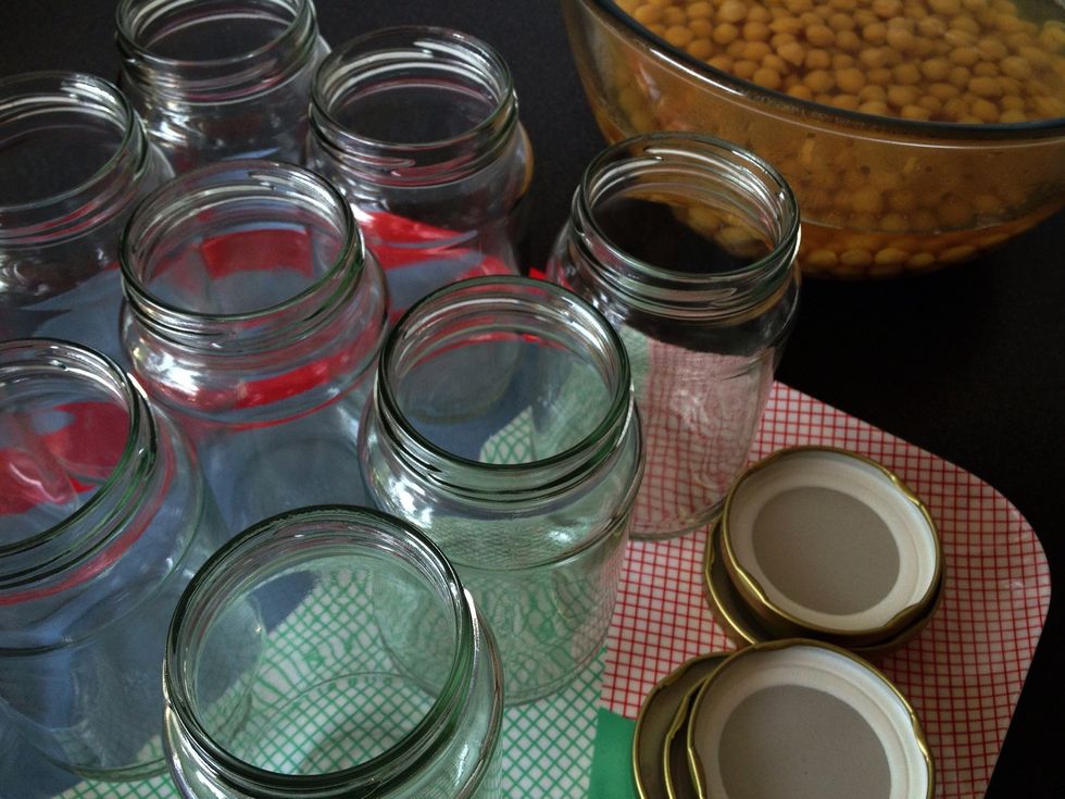 Wash the jars in boiling water to sterilise them. Cook (or part cook) beans according to the instructions on the packet and transfer to a bowl to stop them cooking further. Here I'm using chickpeas.