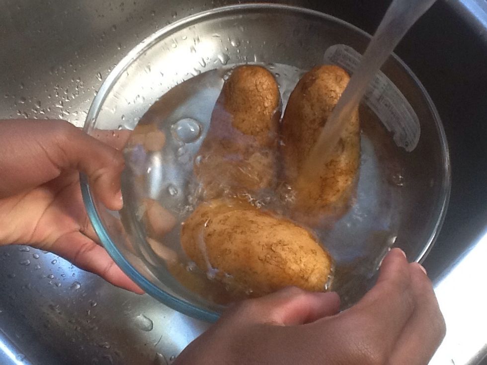 Wash the potatoes.