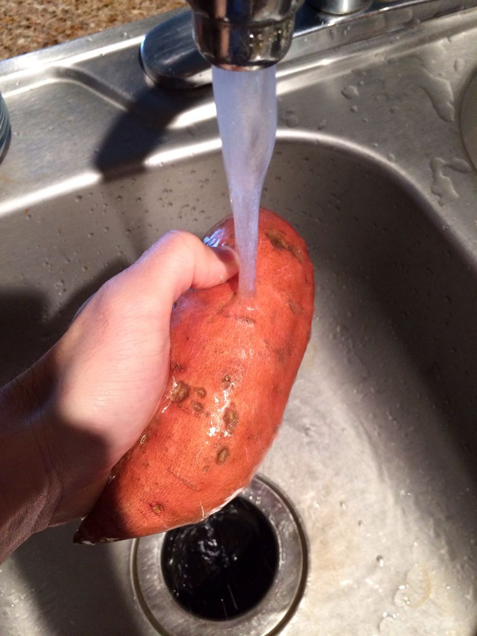 wash the tater but I'd stay away from using soap. just seems weird to me