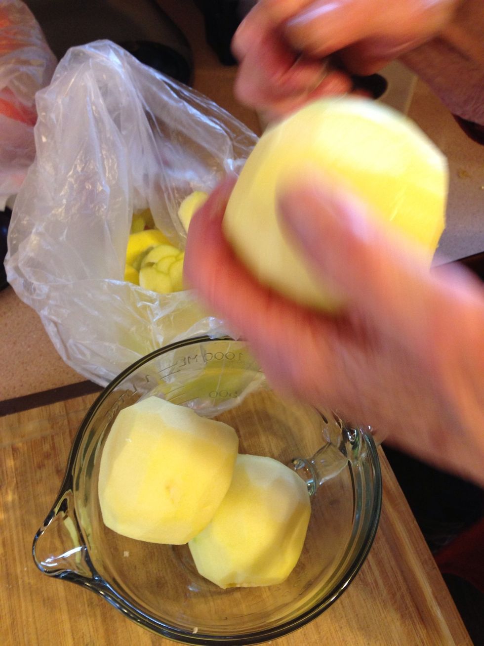Wash, then peel apples. Use the least ripe Gravensteins you can find - they'll add a tartness that helps the flavor.