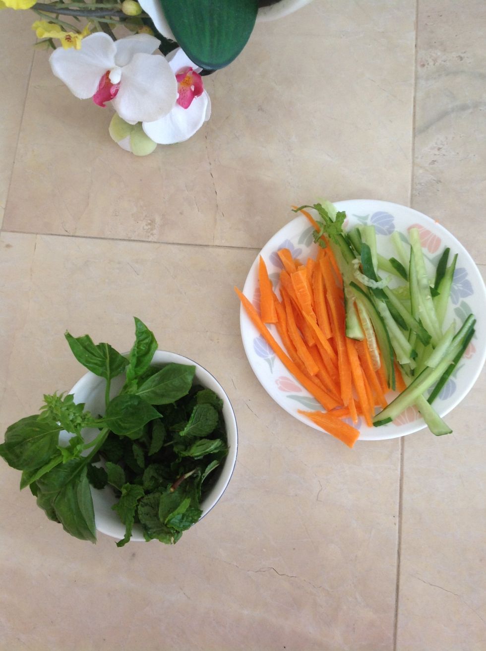 Wash vegetables and herbs; cut the carrots and cucumbers.