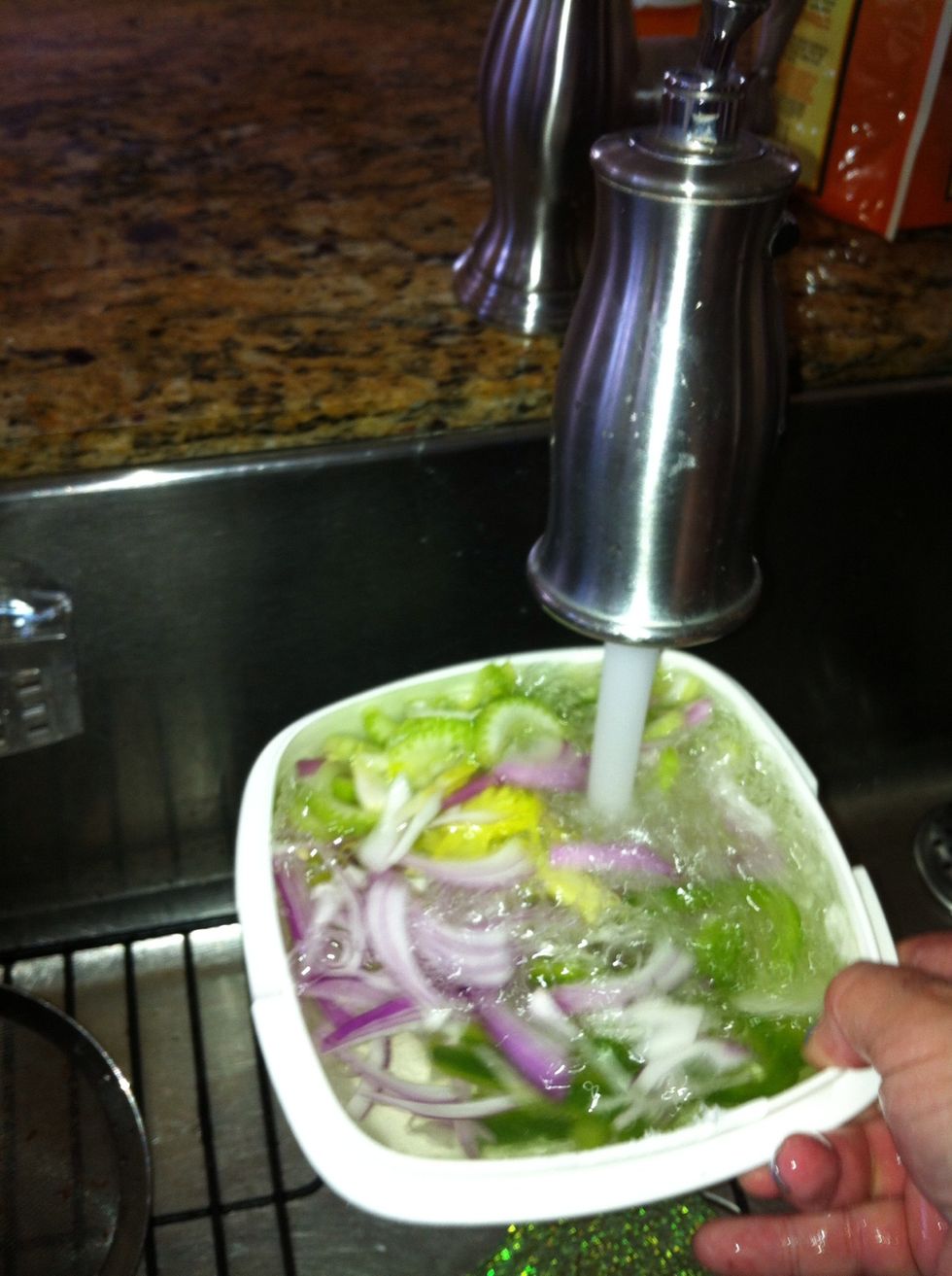 wash with water.. that also make the onions less strong in flavor