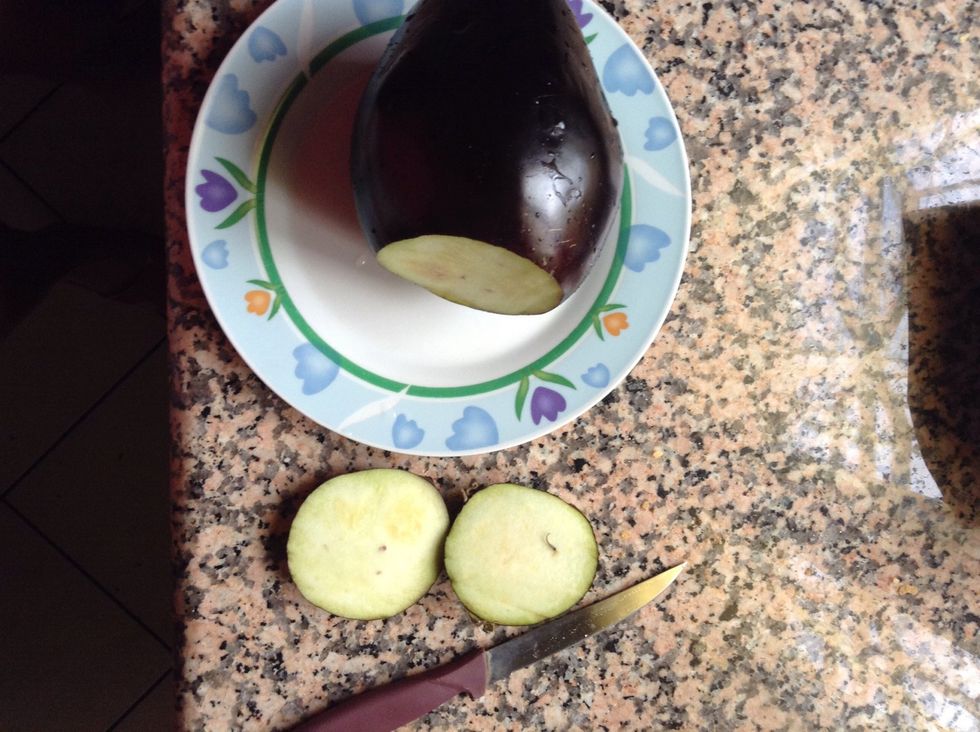 Wash your eggplant and cut off the bottoms.