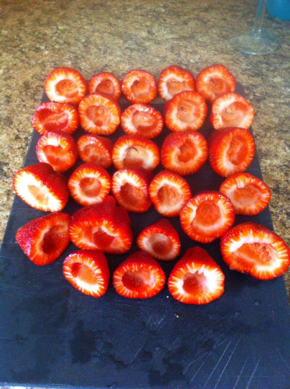 Wash your strawberries. Cut the tops off and Remove the core/center from them. You can use a fruit baller or I find a 1/4 tsp spoon to be the perfect size.
