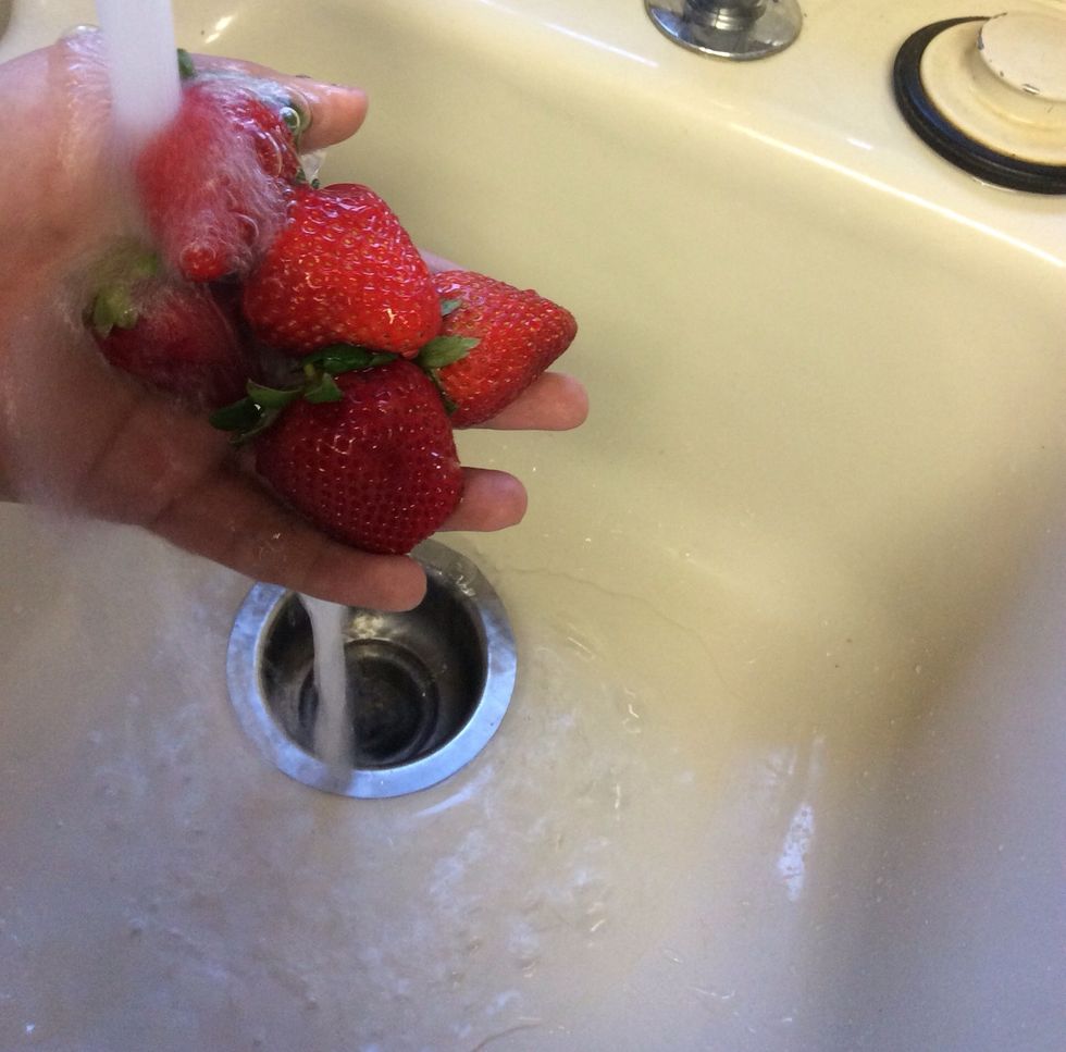 Wash your strawberries under cold water.