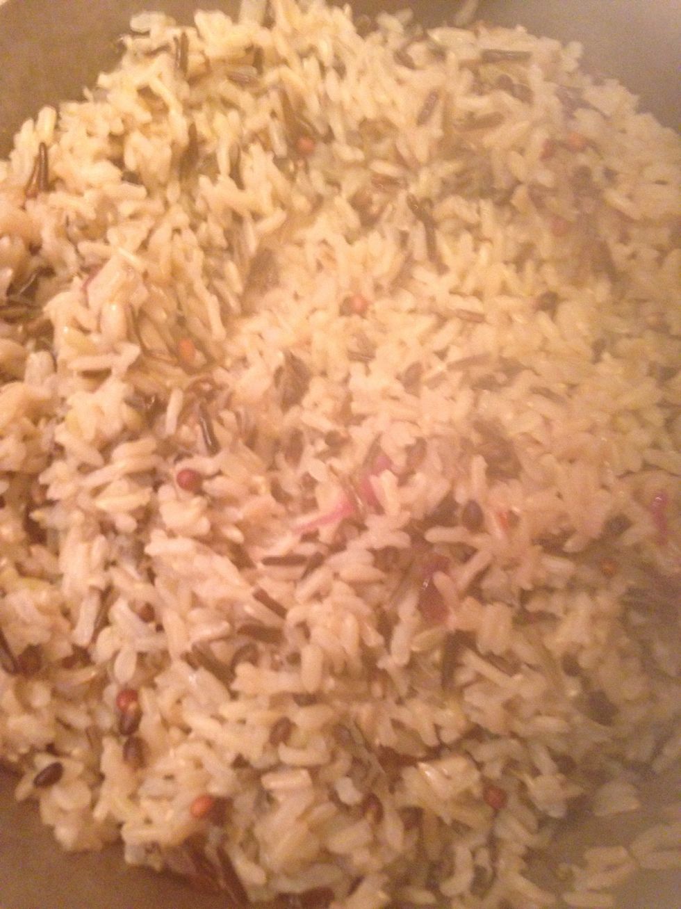 Wash your wild rice.  Add the rice to the water in a pot & bring to a boil. Turn on lowest heat and simmer 30-40 minutes until rice is tender.  Drain & sit to side.