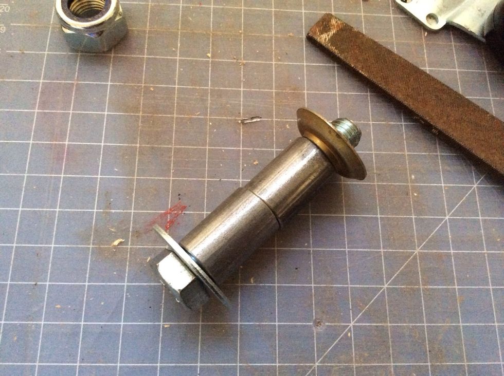 Washer then caps the end. Your bolt must extend enough out to pass through the wood board, in this image, it's too small. I started with longer bolts and then cut them to the correct length.