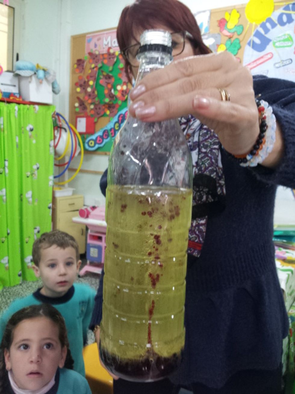 Watch the air bubbles travel up into the oil ..... Observe the children's faces.....