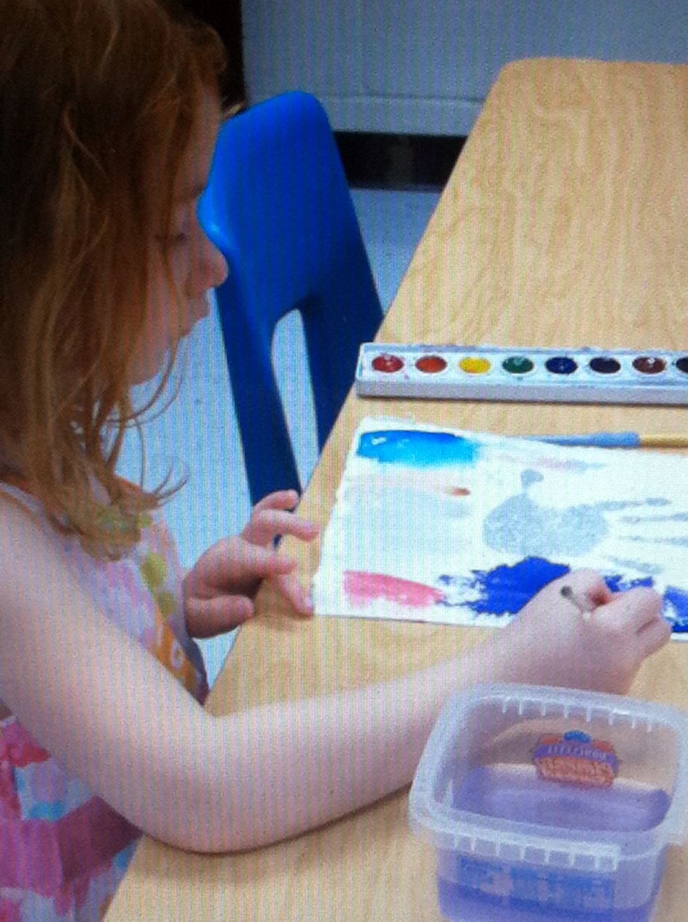 Watercolor all around and on top off the print. The embossed sections will repel the paint.