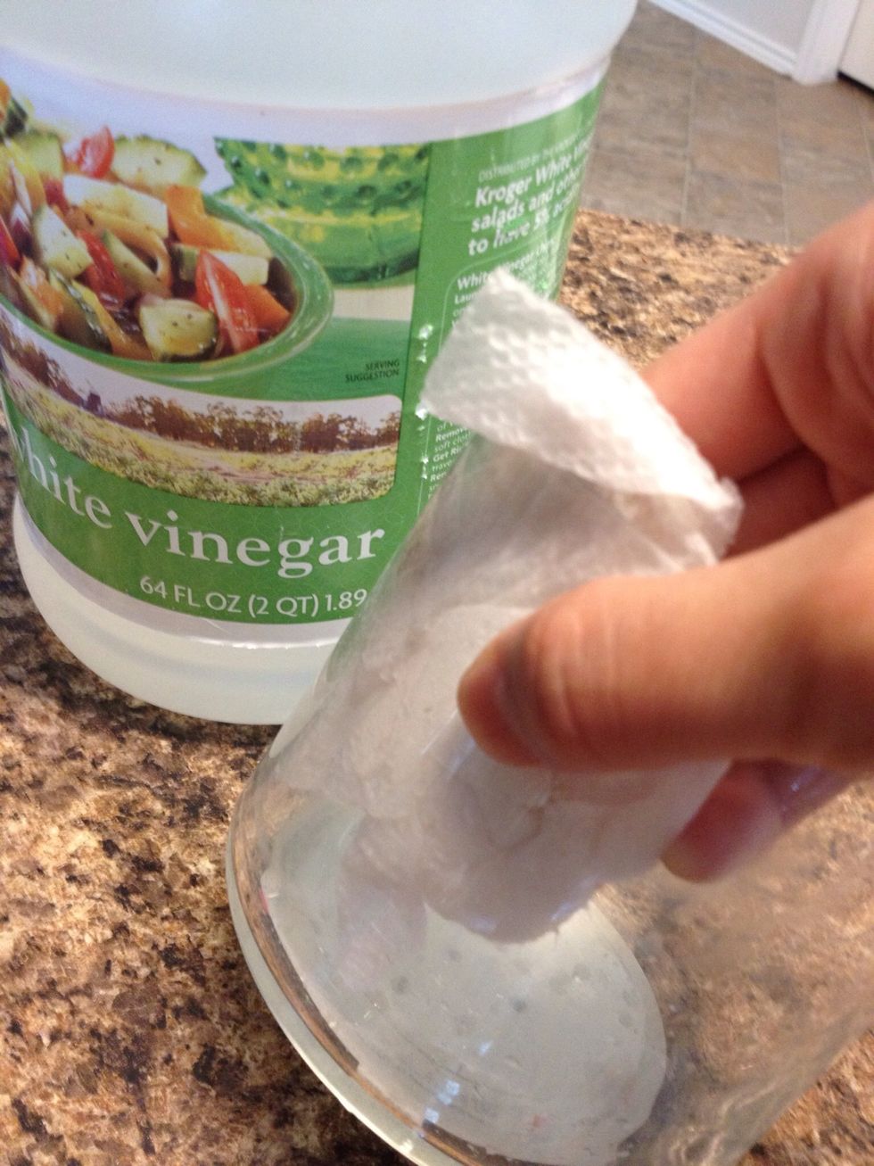 Wax can be easily removed with vinegar, baby oil, olive oil, or orange solvent. I find that baby oil works great. It's also cheap.