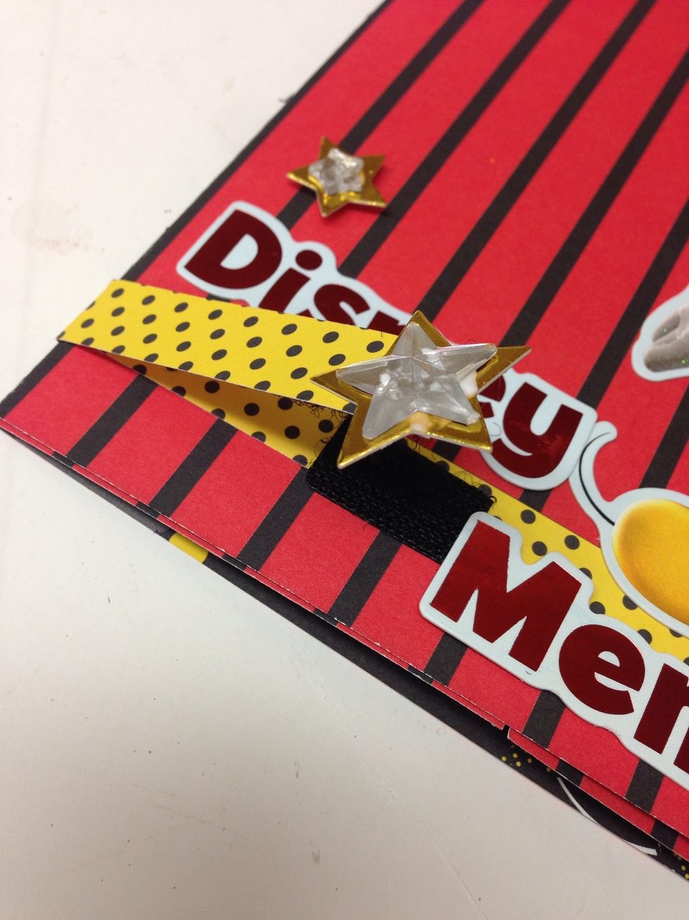 We added a 1/2 inch strip of paper to the back of the album with the extra overlapping the front, then added Velcro to make a closure.