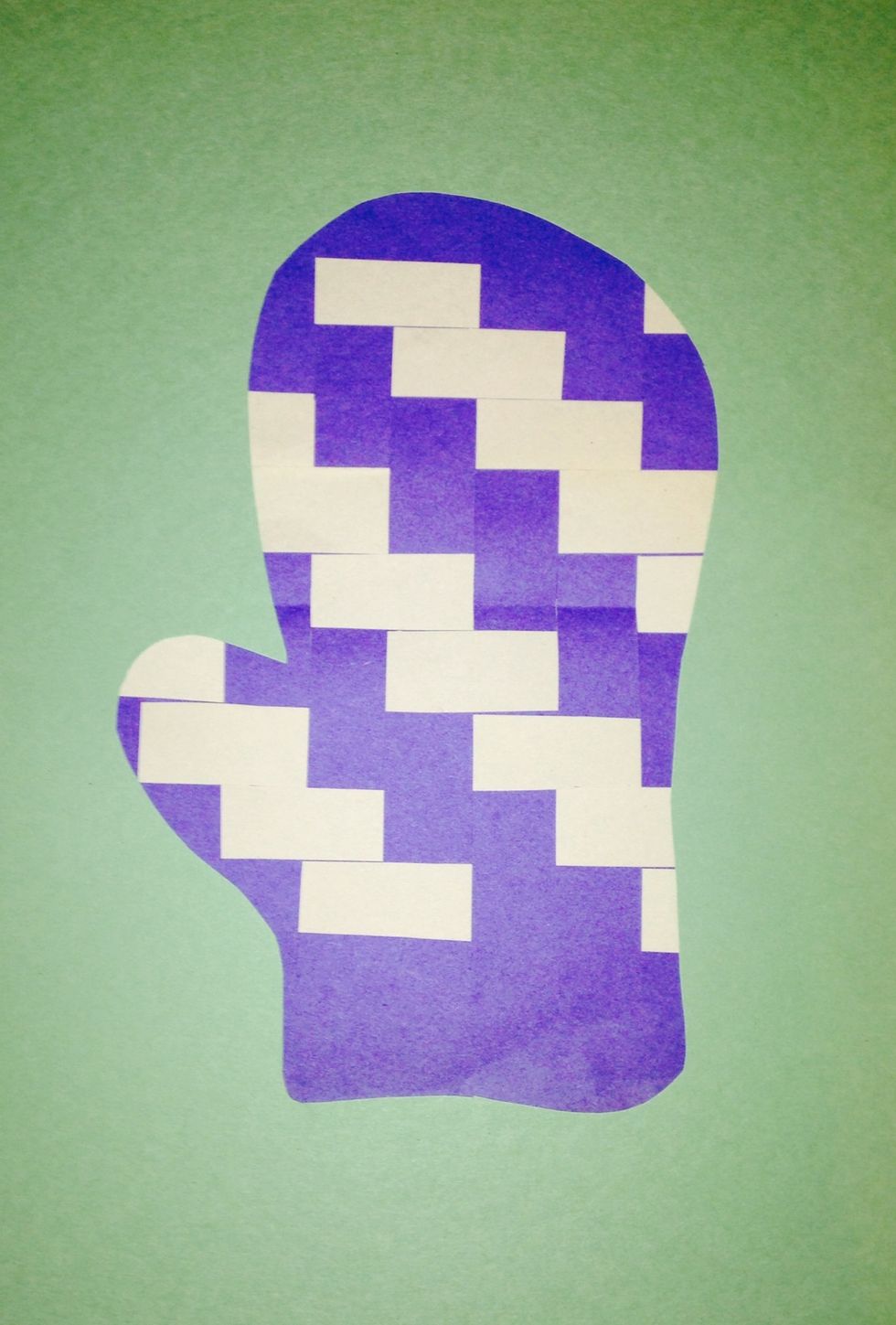 We are going to glue on a mitten so the weaving fills the negative space. To add texture and interest we will use painted paper rather than solid construction paper