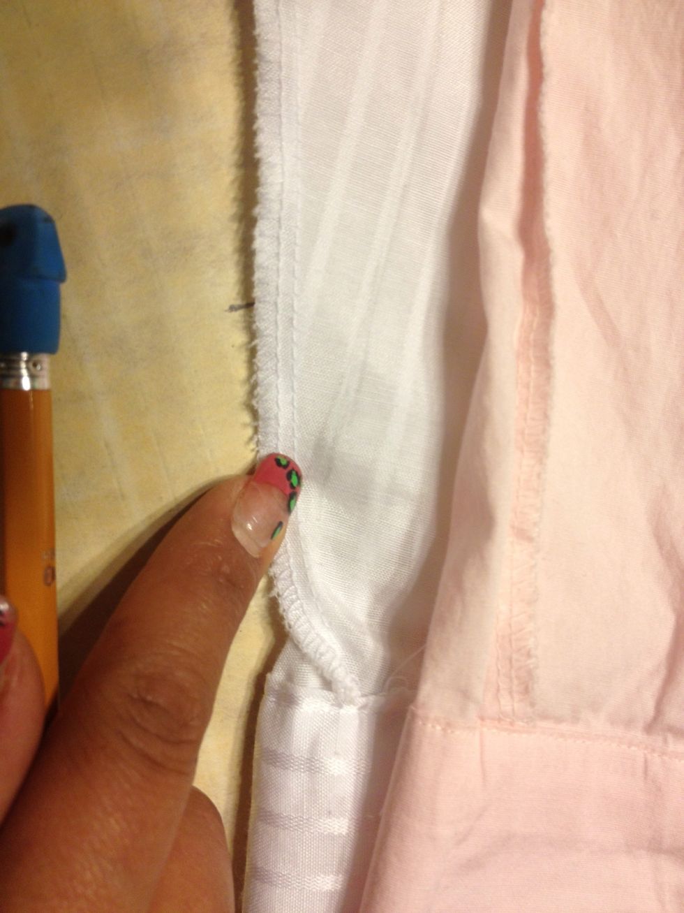 We are NOT going to cut off the cuff. So draw the line to about where you see my finger.