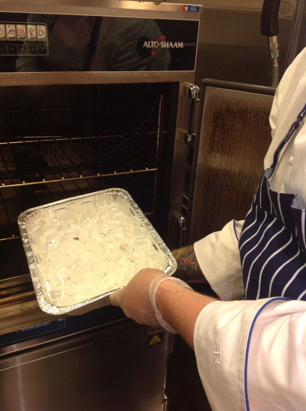 We are using our 767SKIII oven from Alto-Shaam. After loading the wood chips put an ice pan over the smoke box to keep the oven cool.