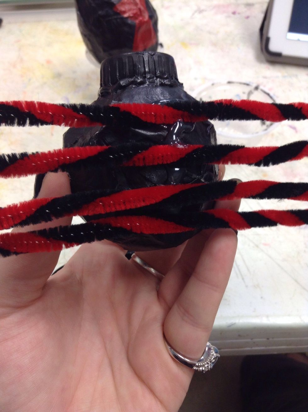 We attached the straight legs to the belly of Mr. Widow with more hot glue.