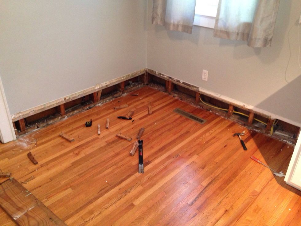 We decided to take off the old baseboards, and repurpose them to use for the front trim of the seating area.