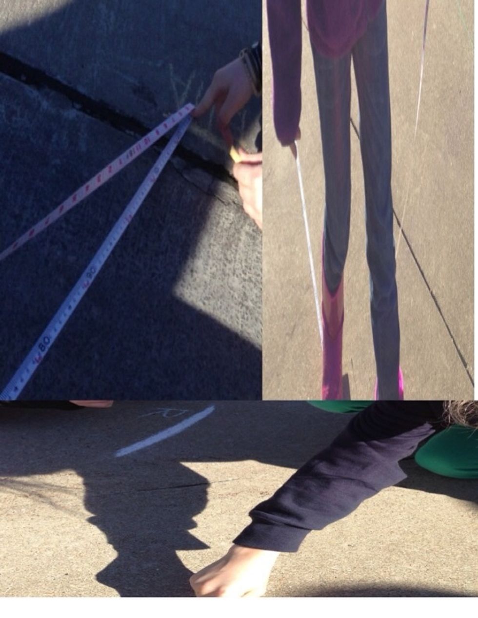 We did a experiment where we measured our shadows. Here we are marking and measuring our shadows.