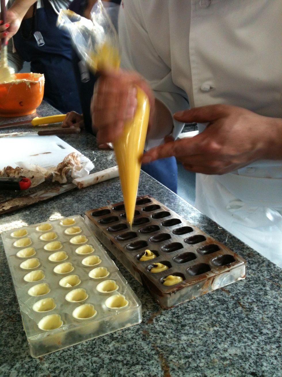 We fill the chocolates ( see how to Cook passion fruit chocolate filling tutirial)