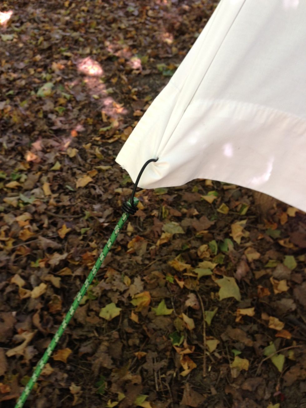 We found it wasn't even necessary to cut a hole... Just push hook through works too.