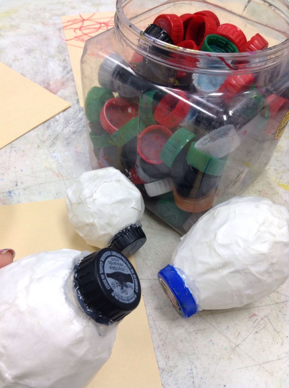 We have a recycle cap jug, they come in handy for tons of crafts.