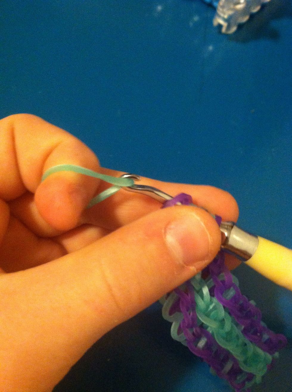 We have to add an extension so take all the bands you ended with and slide them on to a single band