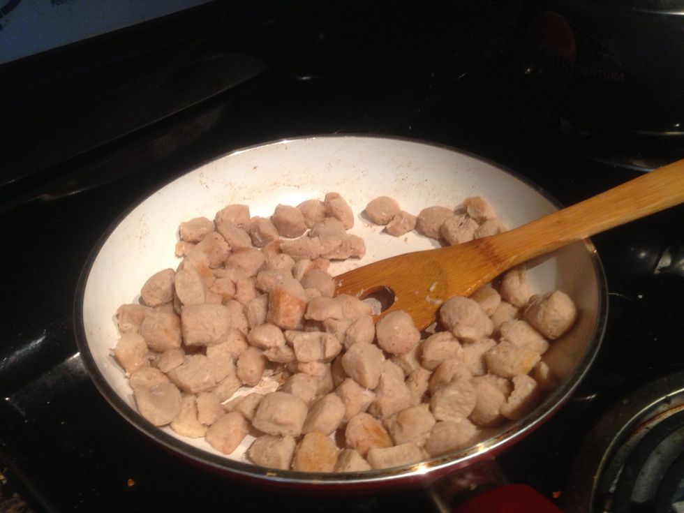We heat the pan again with some vegetable oil. Squeeze the soya chunks with your hand from water as much as possible and them put them into the pan. Light fry them in the pan for about 5 mins.