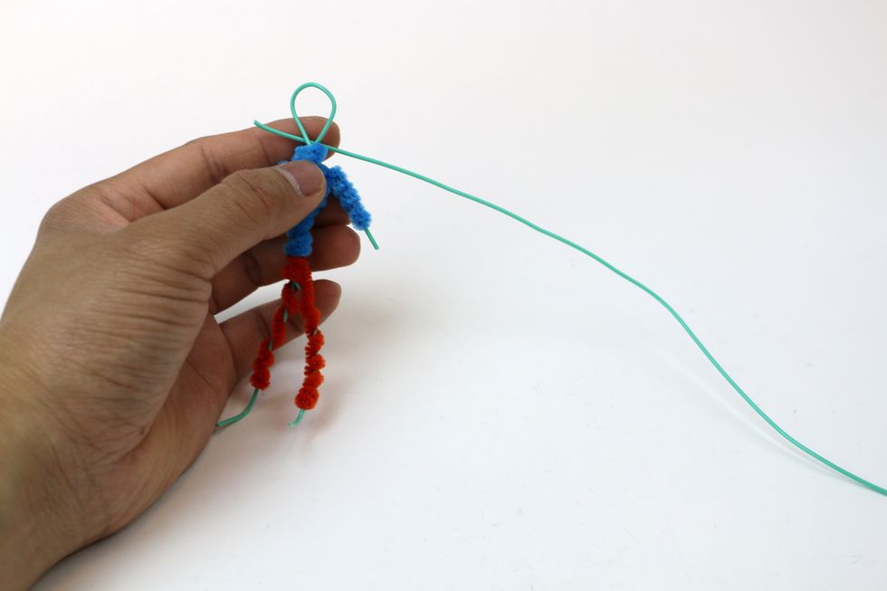 We'll use another wire to wrap around the head loop to form a three- dimensional head.