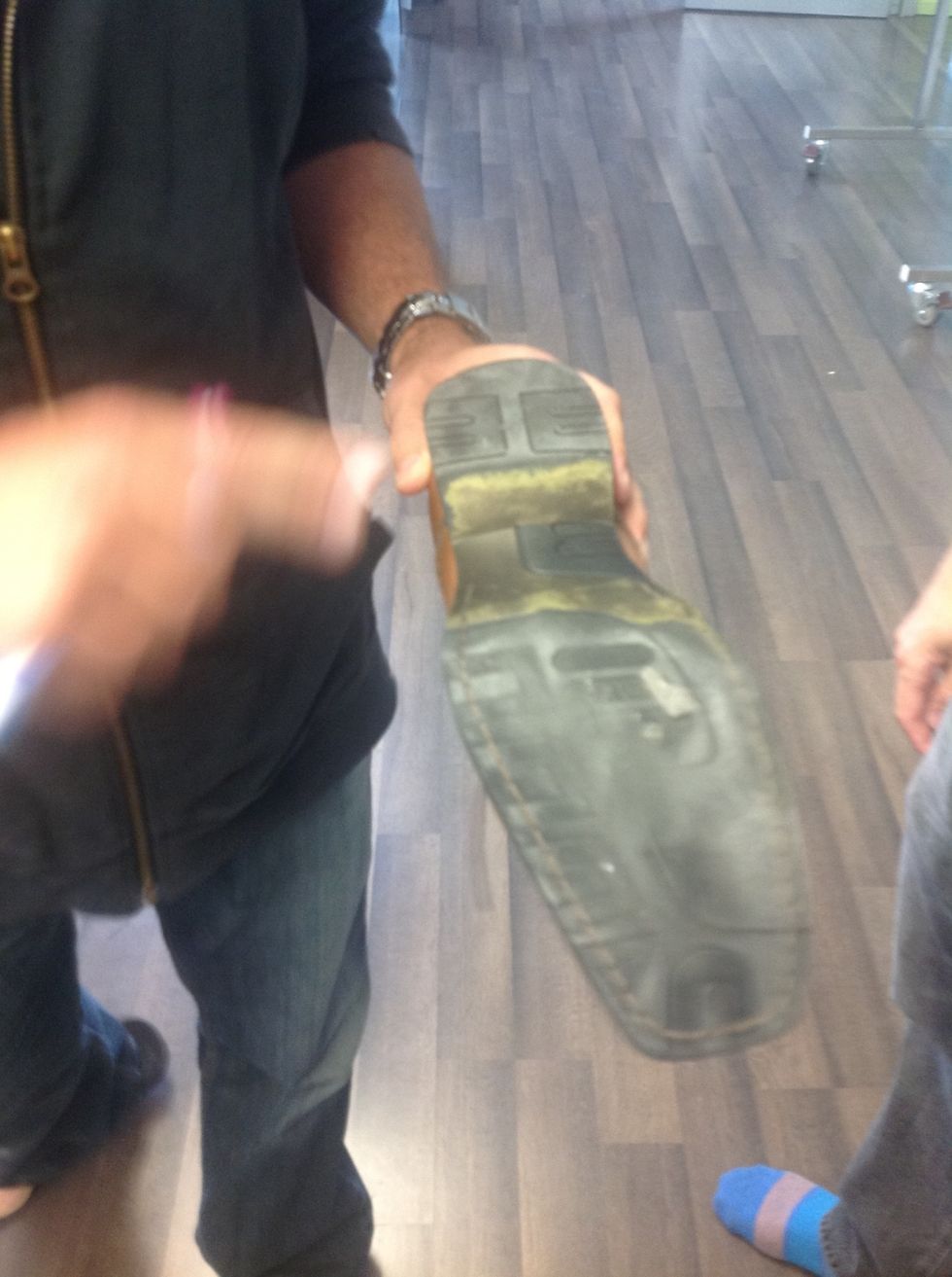 We look at Tanners shoe. We ask what do we see here?