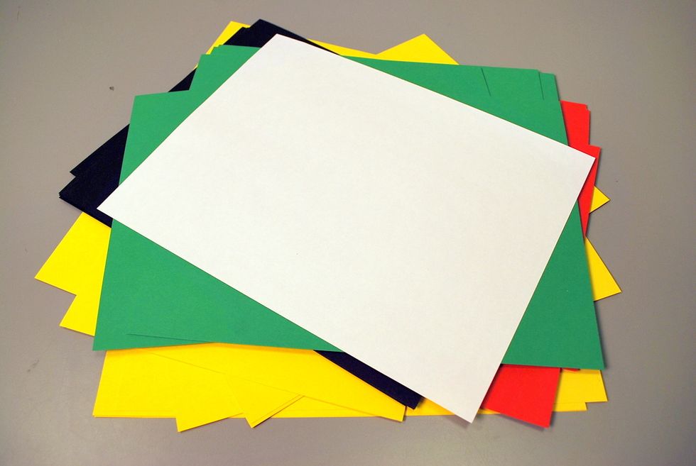 We love using brightly colored blank cover stock. (You can create a template by outlining wings and a tail on a 1/2 side of the folded paper)