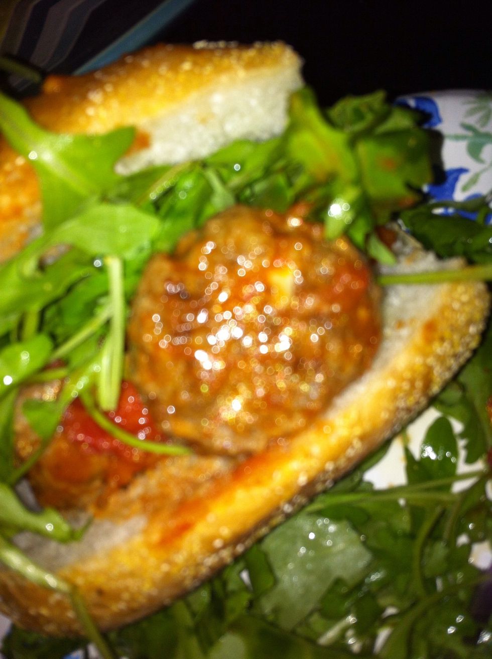 We made mini subs with arugula! They're also perfect for meatball Parmesan sandwiches. Put them in a sub, dress with more sauce, cover with mozzarella and put them in the oven on broil!