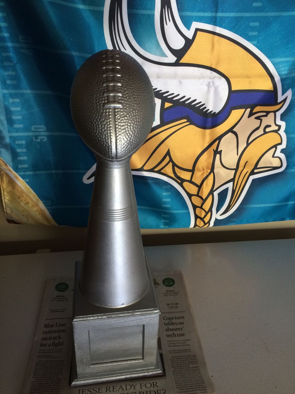 We measured the width of the top of the photo cube, then used a Dremmel to cut the mega horn down until it matched the width, ended up being 3 inches from the base. Then glue it to the top and paint.