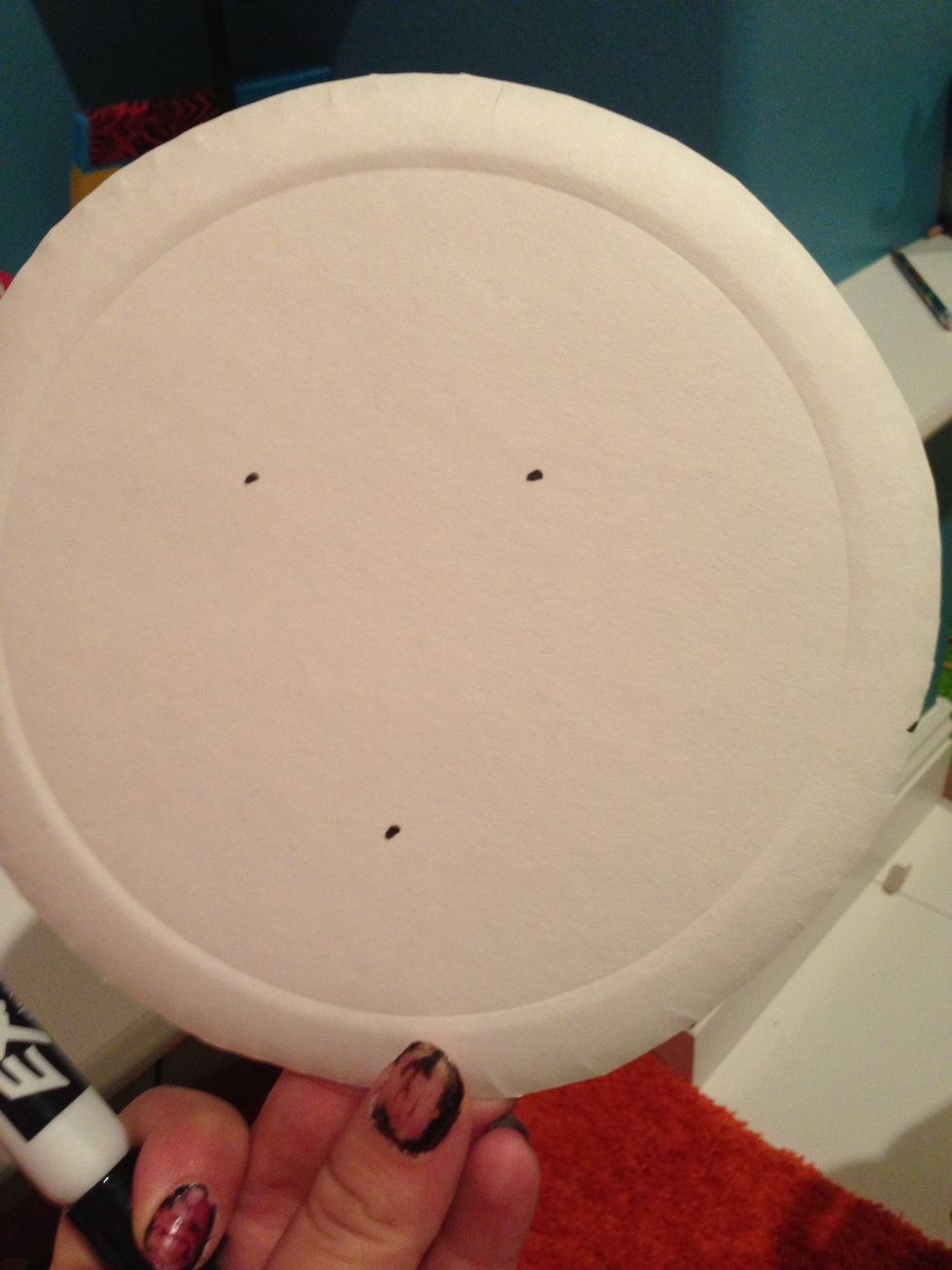 We measured where his eyes and mouth would be! Represent them with dots!  Sorry about my ugly nails, they've been smudged and I peeled them off haha not that you care \ud83d\ude09