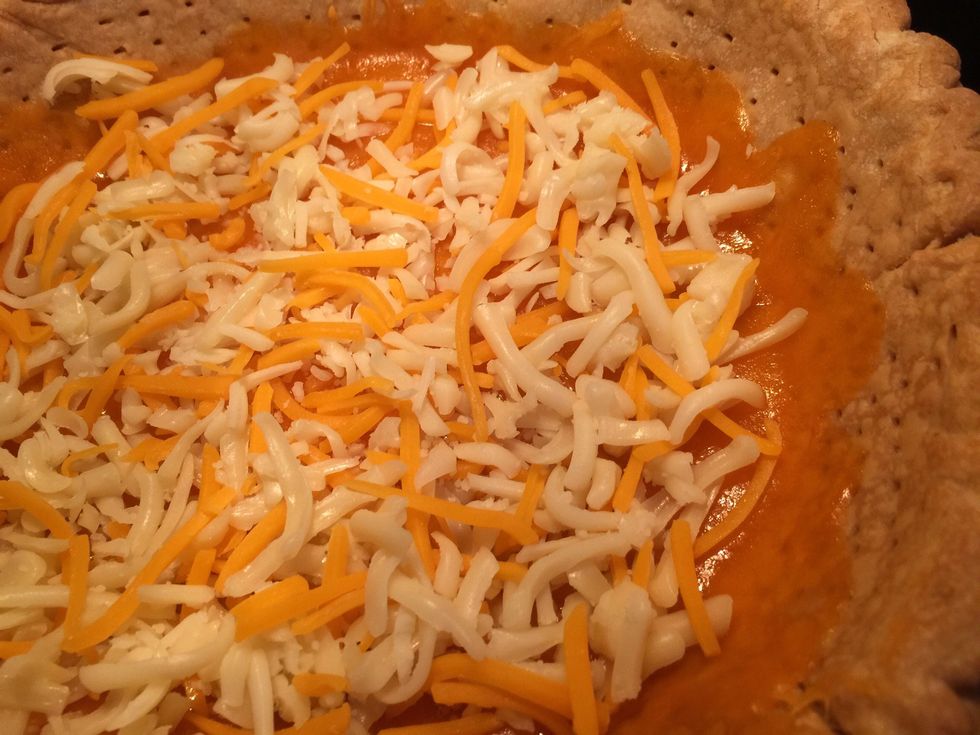 We missed a picture, but we pre-baked the crust until just turning golden. Then spread a small amount of cheese and back in the oven to melt it. Keeps the crust crisp.