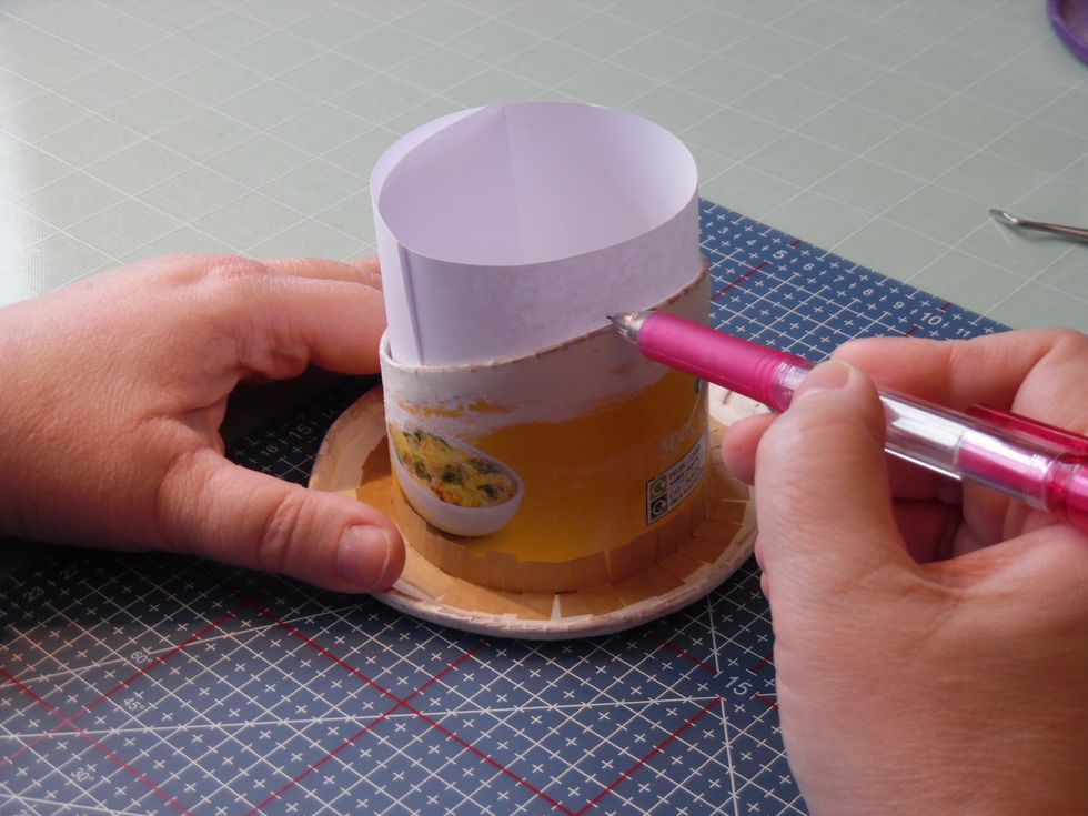 We need to add a lip for the lid to fit over. Due to our 'jaunty angle' this can be a complicated shape. The easiest way to solve this is to insert a piece of paper and draw round the edge.