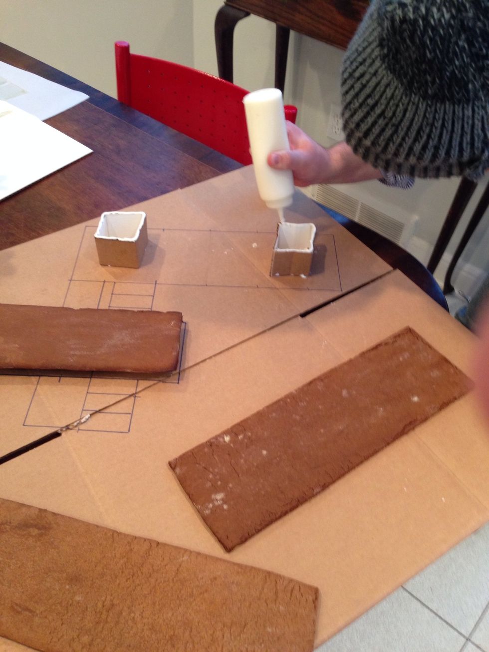 We need to hold the roof up too. We have Elmer's but the engineer is using icing. I told you.