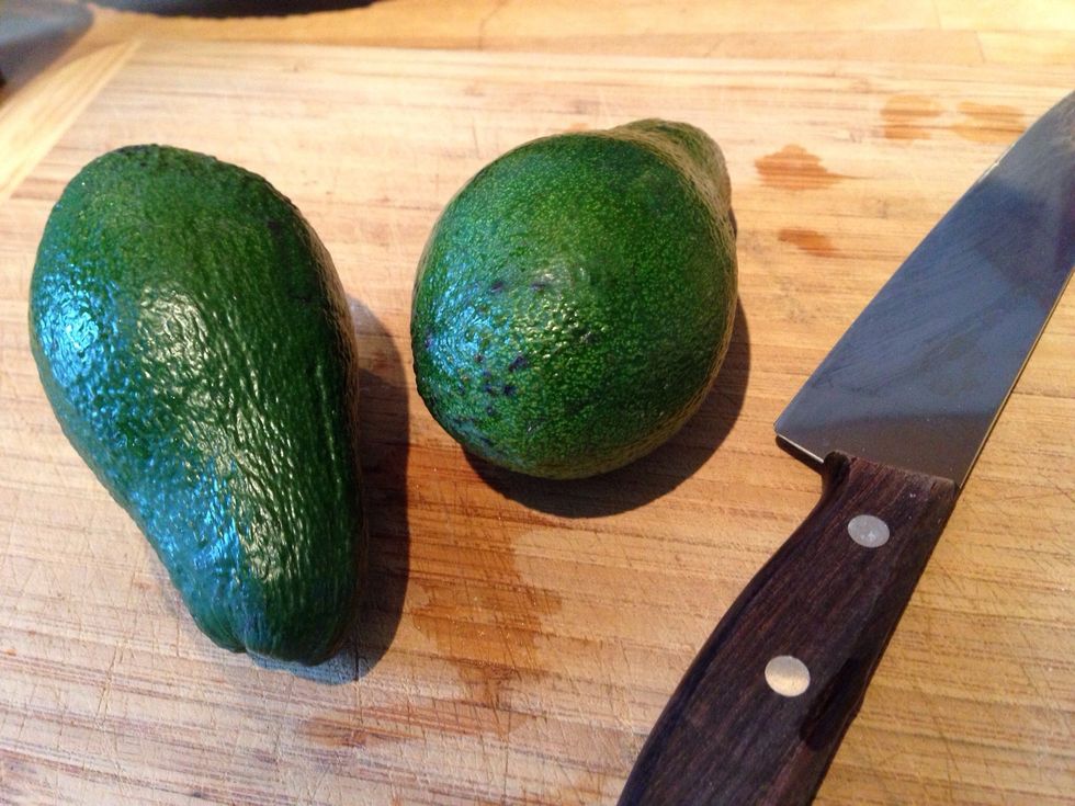 We need two avocados. Ripe avocados. They should feel soft when you gently press them.
