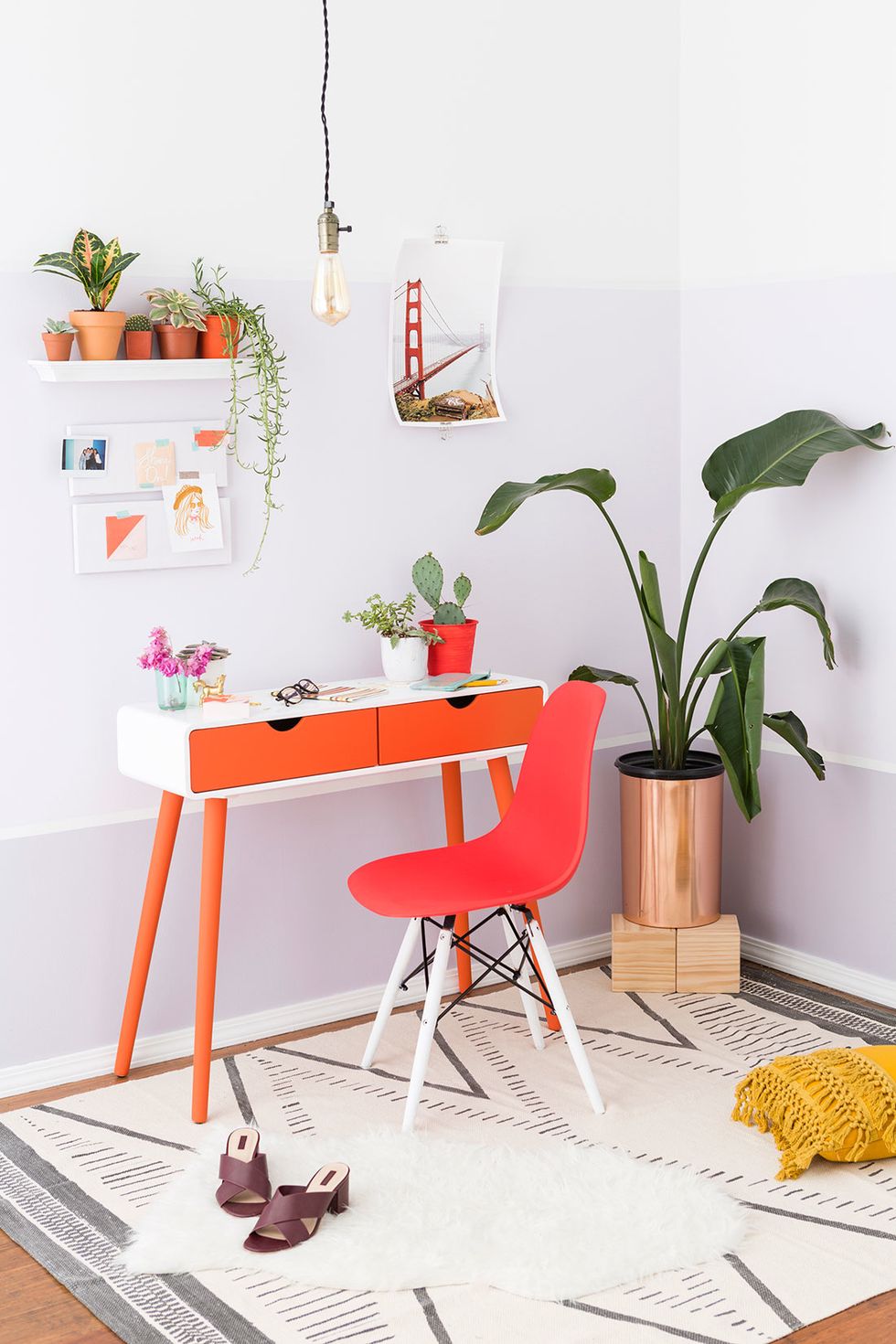 We painted the office\u2019s walls in three tones \u2014Grape Mist SW 6548, Lite Lavender SW 6554 , and Pure White SW 7005 \u2014 to mimic the silhouettes of the hills and cityscape in the background of the photo.