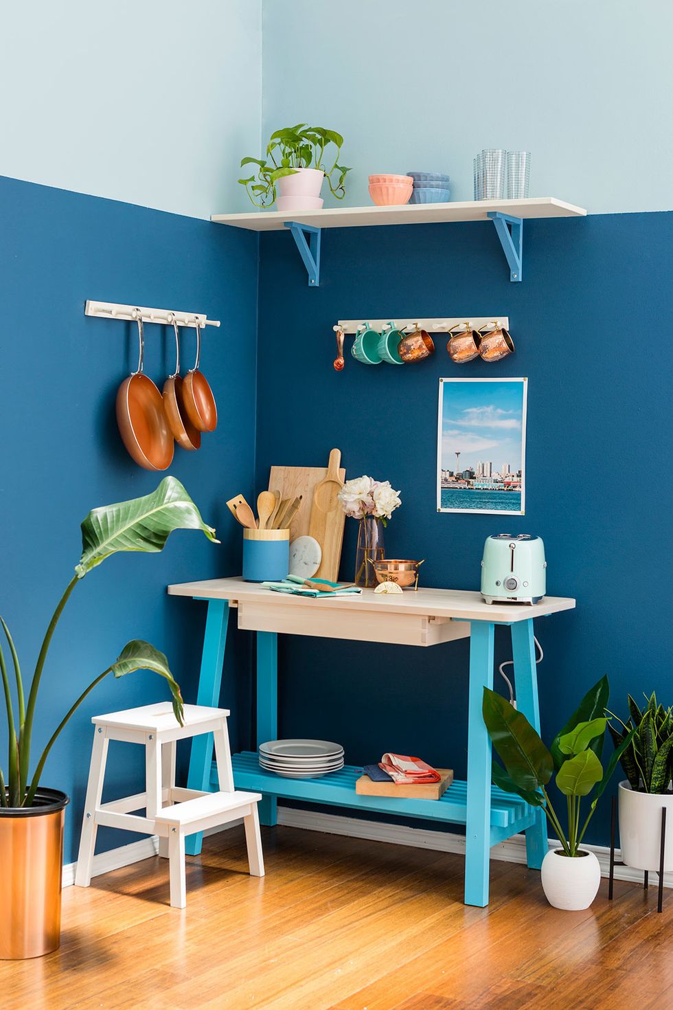 We painted the walls Marea Baja SW 9185 and Billowy Breeze SW 9055, then added Fountain SW 6787, Champagne SW 6644, and Secure Blue SW 6508 as accents throughout the kitchenette.