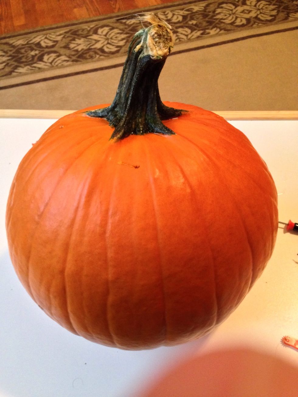 We purchased a medium size pumpkin with a balanced base so it doesn't wobble.The very 1st step would be to run warm water over the pumpkin to remove dirt and then wipe dry.