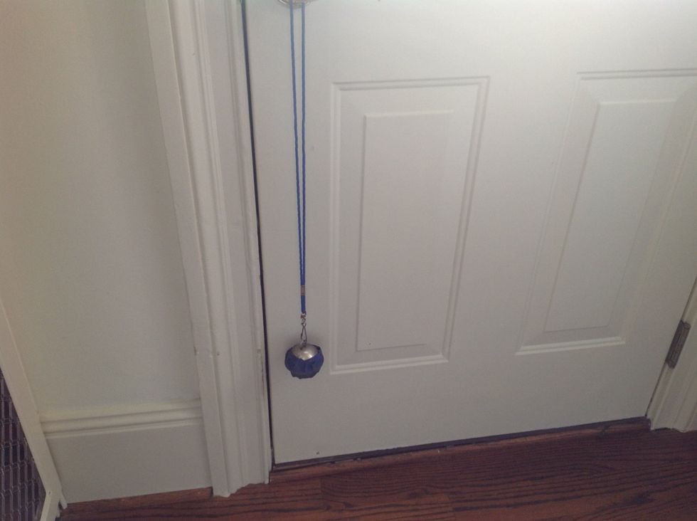 We put tape around our bell so it wouldn't scrape the paint off the door too much.