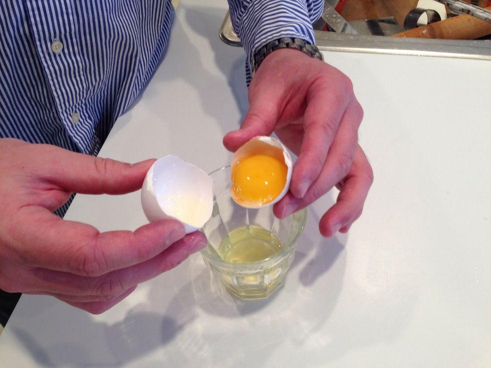 We're going to need royal icing as glue. T. separates eggs. Eggs are easier to separate when they're cold, so go to the fridge and get a bunch. You'll only use 1 egg white but you need to practice.