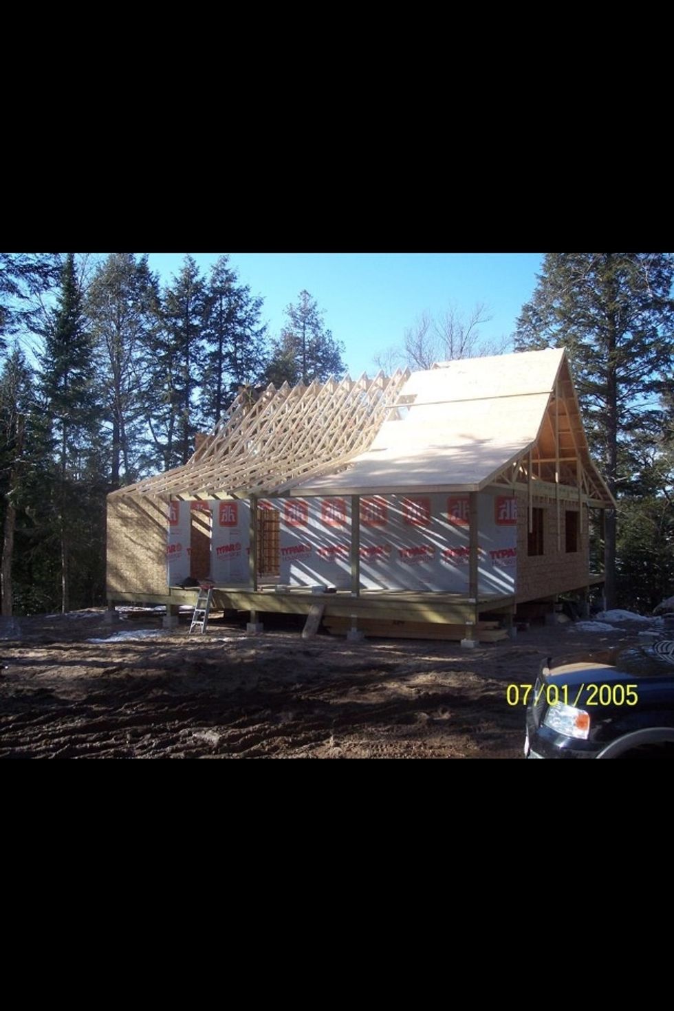 We start to put the plywood on the roof.