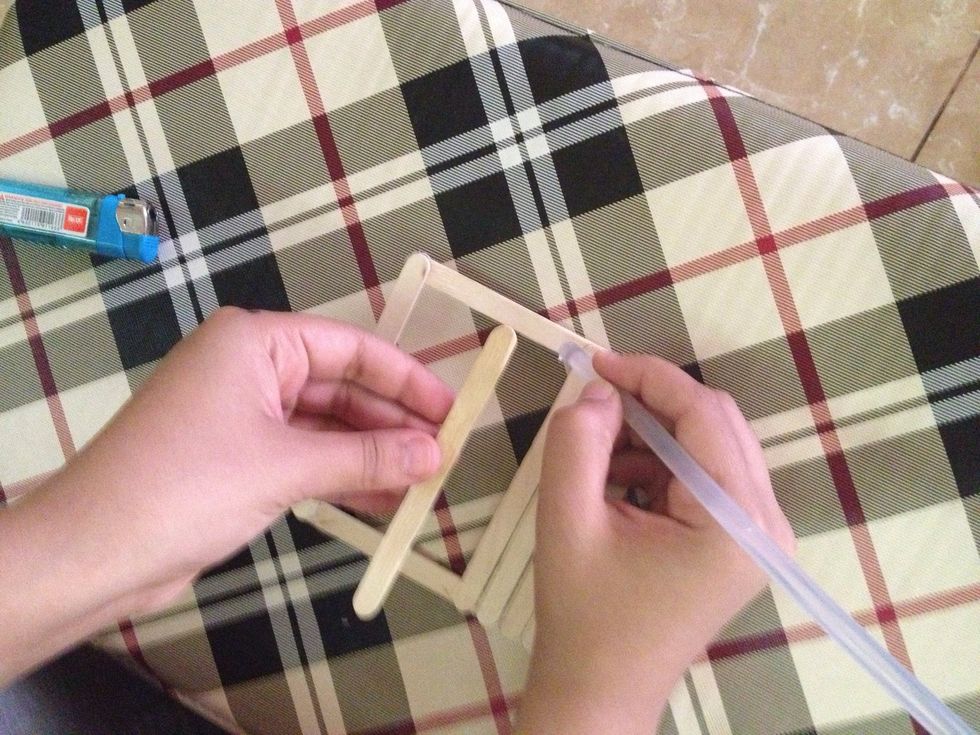 We still keep stucking the sticks with the glue